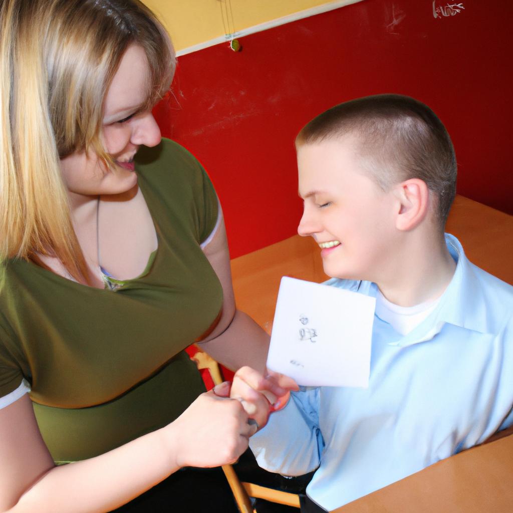 Person teaching autistic student, smiling